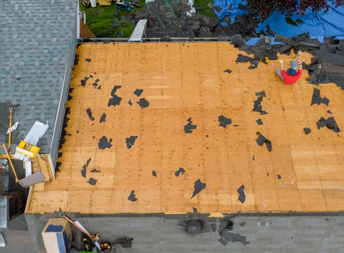Aerial view of a roof tear-off down to the plywood deck